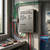 12-24V 400W PWM Wind Turbine Controller for Lithium Battery mounted in a workspace with wiring schematic and tools.