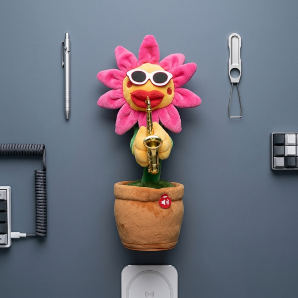 Dancing Musical Sunflower Plush Toy with Saxophone in a flower pot, wearing sunglasses and playing a saxophone.