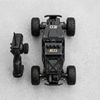 4WD Remote Control Off-Road Rock Crawler Truck and remote controller on a concrete surface.