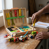 Kids Wooden Tool Set with Portable Storage Case featuring vibrant tools and play vehicles for imaginative roleplay.