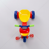 Kids First Pedal Tricycle Ride-On Toy in red and yellow with wide wheels and green handlebars, perfect for toddlers.
