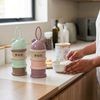 3-Compartment Baby Formula & Snack Dispenser displayed on a kitchen counter, showing its convenient compartments.