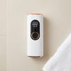 Electric Hair Removal Device with Digital Display on a surface next to a white towel.
