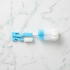 2-in-1 Baby Bottle & Teat Cleaning Brush Set with sponge tips and nylon bristles on a marble surface.
