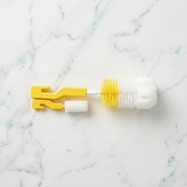 2-in-1 Baby Bottle & Teat Cleaning Brush Set with soft sponge tips and nylon bristles on a marble surface.