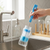 2-in-1 Baby Bottle & Teat Cleaning Brush Set being used to clean a baby bottle under running water.