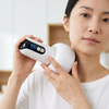 Woman using the Electric Massage Device with Digital Controls on her neck.