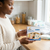 Pre-Sterilised Breast Milk Storage Bags packaging in kitchen with BPA Free label, ideal for storing expressed milk.