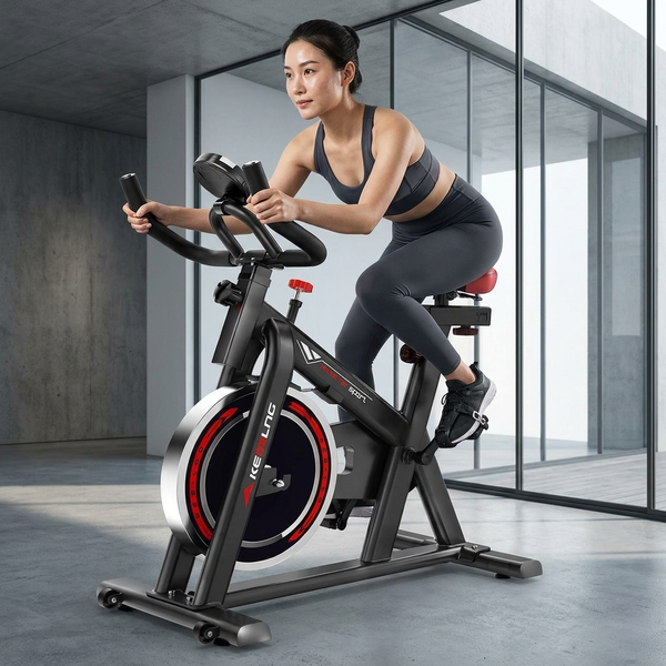 Indoor Spin Bike with Digital Display & Flywheel being used for an intense workout at home.