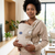 Multi-Position Adjustable Baby Carrier & Sling used by a mother to carry her baby comfortably at home.