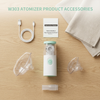 Portable Mesh Nebulizer with Masks and USB Cable and its accessories on a wooden surface.