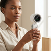 Woman using a Portable Handheld Turbo Fan with Digital LED Display for personal cooling