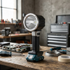 Rechargeable LED Torch on a workbench, showcasing its bright light and portable design for various uses.