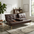 Modern Tufted Faux Leather Sleeper Couch in a stylish living room setting with plants and decor.