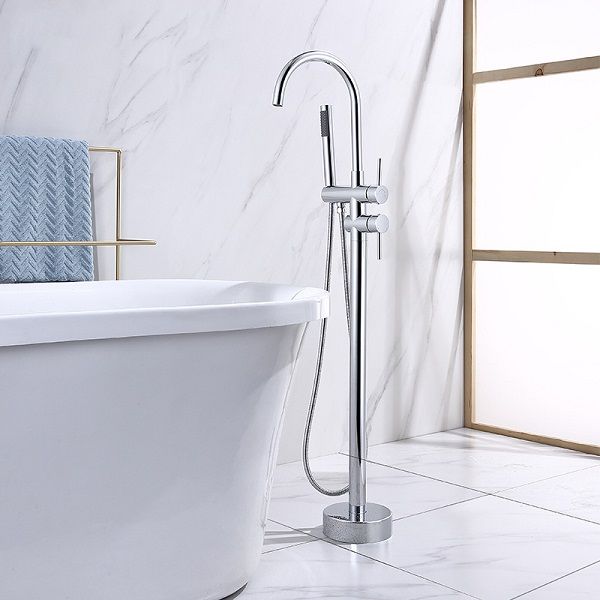 Stylish Free Standing Chrome Bath Mixer next to freestanding tub, enhancing modern bathroom decor.