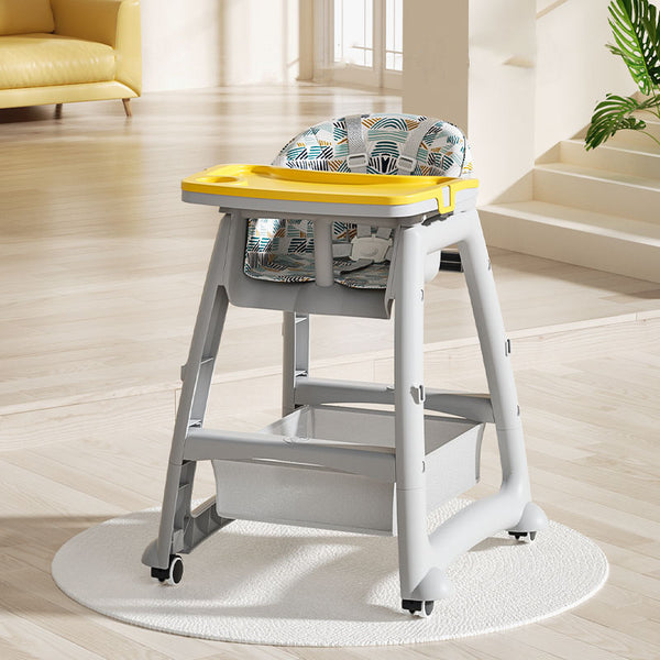 Secure Adjustable High Chair with 5-Point Safety Harness in a modern dining area with a yellow tray.