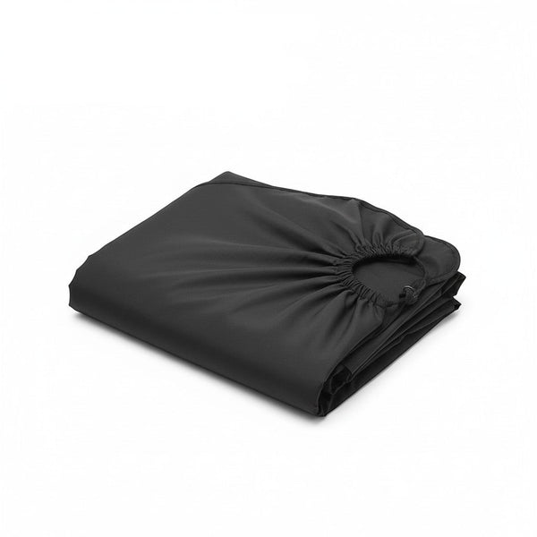 Water-Resistant Haircut Apron & Barber Cutting Cape folded in black, showcasing its durable and protective material.