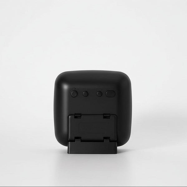 Back view of Digital Alarm Clock with Temperature and Humidity Display showing buttons and stand.