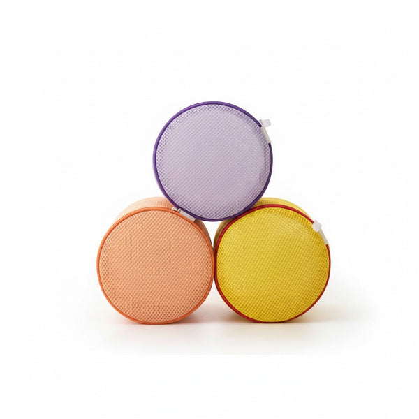 Small Round Mesh Laundry Bag in three colors: orange, purple, and yellow, stacked for laundry organization.