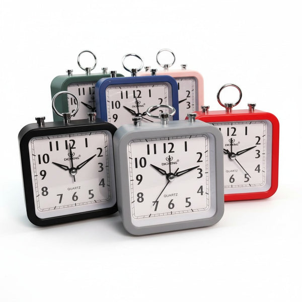 Wake Mate Modern Kids Bedside Alarm Clock in various colors stacked together, emphasizing their compact and modern design.