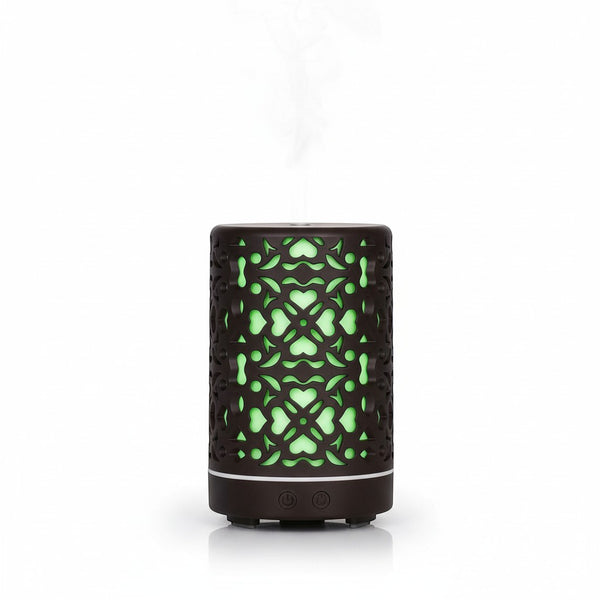 Compact Home & Office Air Humidifier with intricate design and green glow, emitting mist for improved air quality.