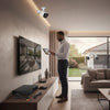 5MP 4-Channel NVR PoE Security Camera Kit installation in modern home with user monitoring.