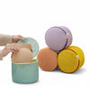 Small Round Mesh Laundry Bag being used to organize items, showcasing its mesh design and compact, colorful storage.