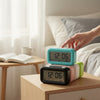 Digital Alarm Clock with Night Light displayed on a bedside table next to a book and cup.
