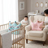 Crown Shaped Decorative Pillow in a nursery setting with child and parent for playful accent in cozy corner