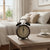 Retro Twin Bell Alarm Clock on a bedside table, featuring a vintage design with twin bells and an analog face.