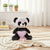 Sequin Panda Plush Toy sitting on a fluffy rug with a small gift box, showcasing its colorful sequined design.