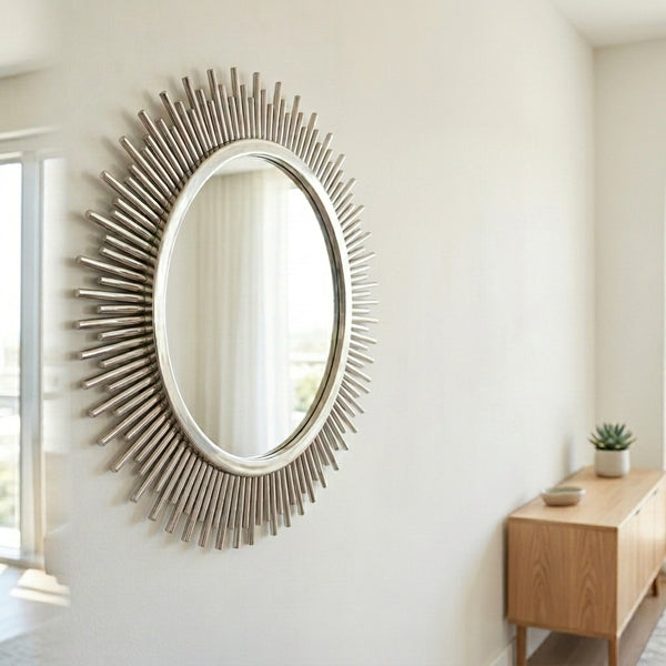 Sunburst Decorative Round Wall Mirror on a wall, adding elegance and style to a modern living space.