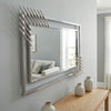Modern Geometric Decorative Wall Mirror with an artistic multi-paneled design, enhancing light and space in a room.