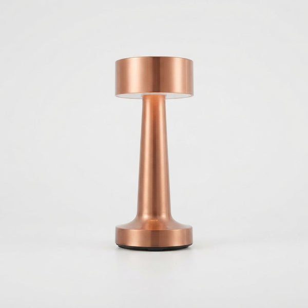 Modern Cordless Copper Turret Table Lamp showcasing a sleek copper design and touch dimming feature.