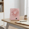 Portable Rechargeable Desktop USB Fan on a desk, providing personal airflow in a stylish pink design.