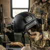 Military-Style Tactical Helmet held by an operator in tactical gear, showcasing its design for costume and display purposes.