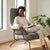 Zen Lounge Chair featuring a woman reading comfortably in a modern, minimalist design with a sleek frame and spacious seat.